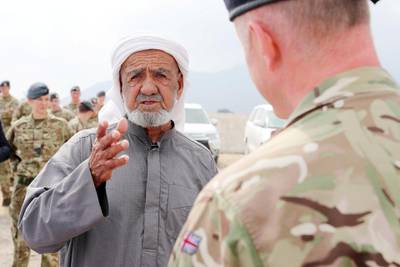 FUJAIRAH , UNITED ARAB EMIRATES , FEB 14  – 2018 :- Mohamed Homoud Hazzaa Alsereidi , Emirati talking to Captain Jim Lowther from Royal Navy , Defence Attaché , Abu Dhabi during the interview after the memorial service of William Henry Donnelly , Sergeant , Royal Air Force who was died on 14 February 1943 after his Wellington Bomber crashed during the WW2 in Fujairah. Mohamed Homoud Hazzaa Alsereidi was young boy when the plane was crashed near his village. ( Pawan Singh / The National ) For News. Story by John