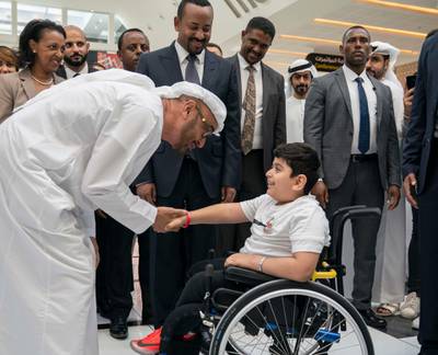 ABU DHABI, UNITED ARAB EMIRATES - March 18, 2019: HH Sheikh Mohamed bin Zayed Al Nahyan, Crown Prince of Abu Dhabi and Deputy Supreme Commander of the UAE Armed Forces (L) and HE Abiy Ahmed, Prime Minister of Ethiopia (back C), tour the Special Olympics World Games Abu Dhabi 2019, at Abu Dhabi National Exhibition Centre (ADNEC).

( Ryan Carter / Ministry of Presidential Affairs )?
---