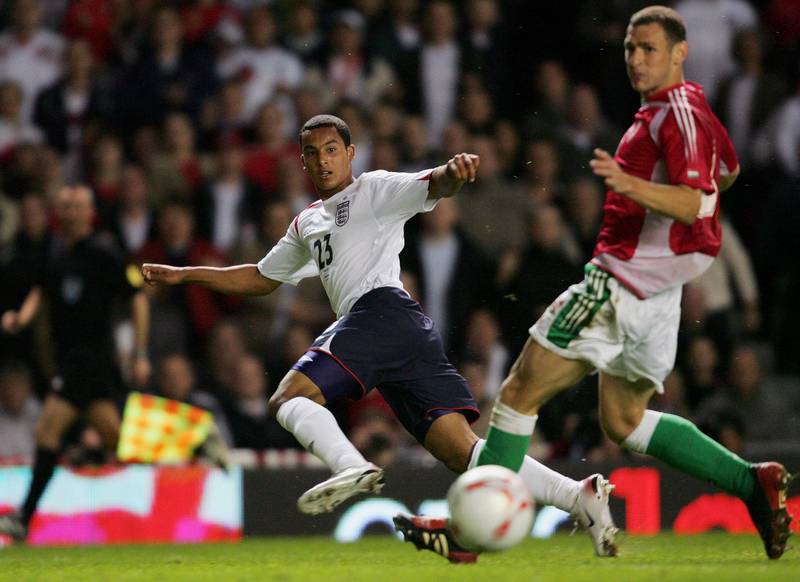 MANCHESTER, UNITED KINGDOM - MAY 30:  Theo Walcott of England shoots on goal as he makes his full debut during the International Friendly match between England and Hungary at Old Trafford on May 30, 2006 in Manchester, England.  (Photo by Ross Kinnaird/Getty Images)