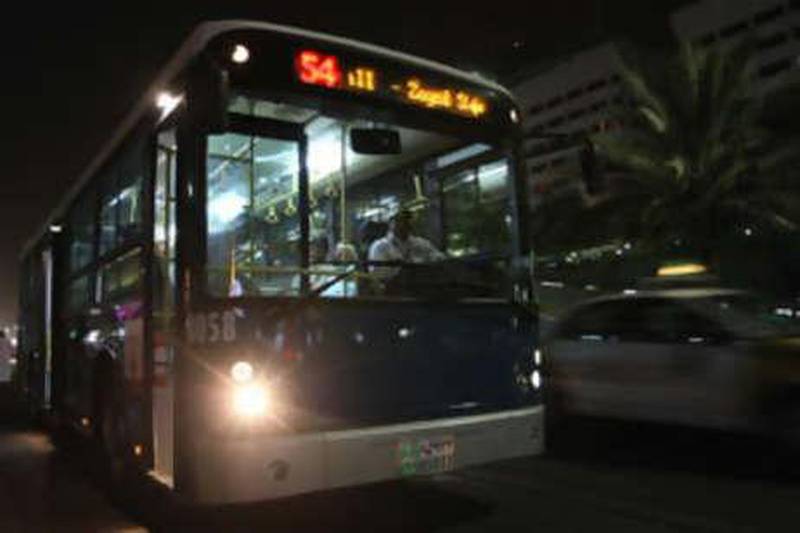 The no 54 night bus stops for passengers on its way to Abu Dhabi mall.