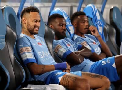 Neymar watches form the bench in the first-half. Reuters