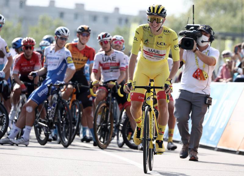 Team UAE Emirates rider Slovenia's Tadej Pogacar wearing the overall leader's yellow jersey attends the start of the 21st and last stage of the 107th edition of the Tour de France cycling race, 122 km between Mantes-la-Jolie and Champs Elysees Paris. AFP