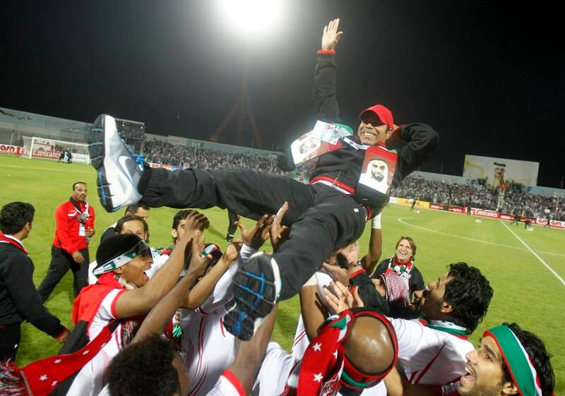 UAE's coach Mahdi Ali Hasan (C) celebrates with his team after winning their final game against Iraq at the Gulf Cup Tournament in Isa Town, January 18, 2013. REUTERS/Mohammed Dabbous (BAHRAIN - Tags: SPORT SOCCER) *** Local Caption ***  BAH12D_SOCCER-_0118_11.JPG