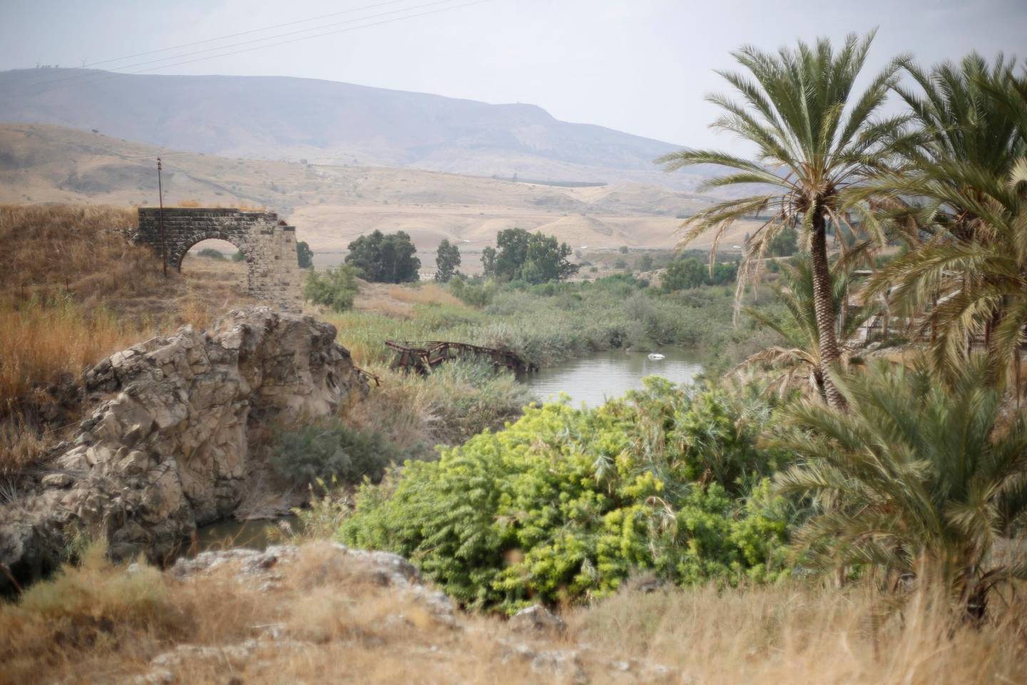 The Jordan river flows in the Jordan valley area called Baqura, Jordanian territory that was leased to Israel under the 1994 peace agreement between the two countries, Monday, Oct. 22, 2018. Jordan's King Abdullah II on Sunday said he has decided not to renew the lease on two small areas of Baqura and Ghamr, that was part of his country's landmark peace treaty with Israel. The leases expire next year after 25 years. (AP Photo/Ariel Schalit)