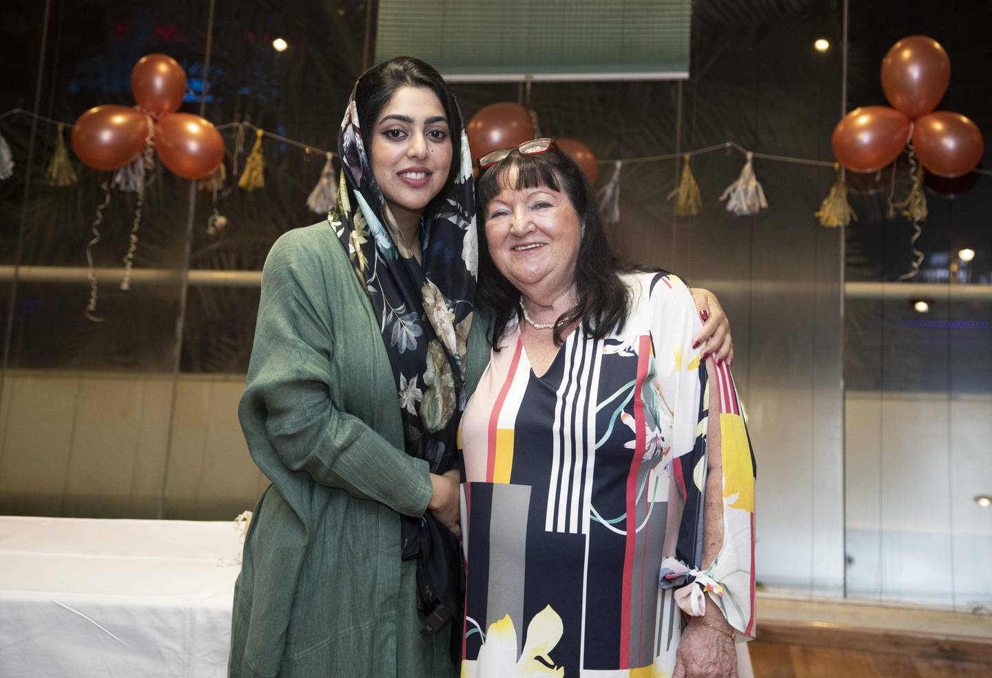 Rita Bufton with Reem Ali at her farewell party after more than 40 years in the UAE.  Ruel Pableo for The National