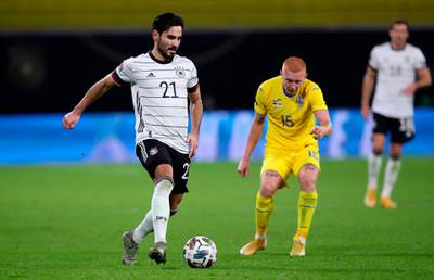 Germany midfielder Ilkay Gundogan under pressure from and Ukraine defender Yukhym Konoplia. AFP