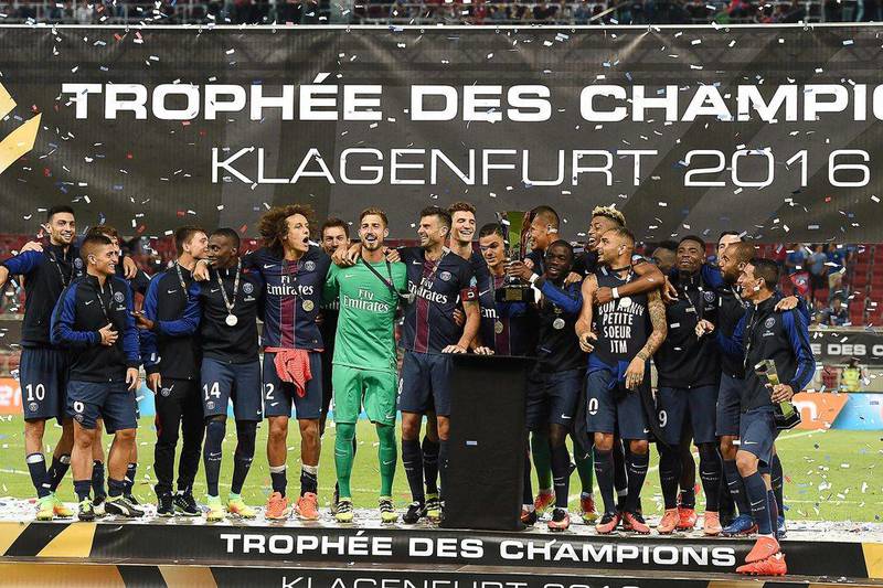 Players of Paris Saint-Germain celebrate after winning the Trophee des Champions ‘super cup’ match between PSG and Lyon in Klagenfurt, Austria, on August 6, 2016. Boris Horvat / AFP