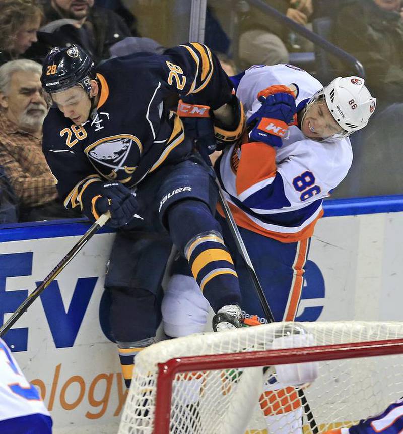 Buffalo Sabres' Zemgus Girgensons, left, has captured the hearts of the Latvian people, so much so, they've voted him to the top of the NHL all-star ballot. Harry Scull Jr/AP Photo/The Buffalo News.