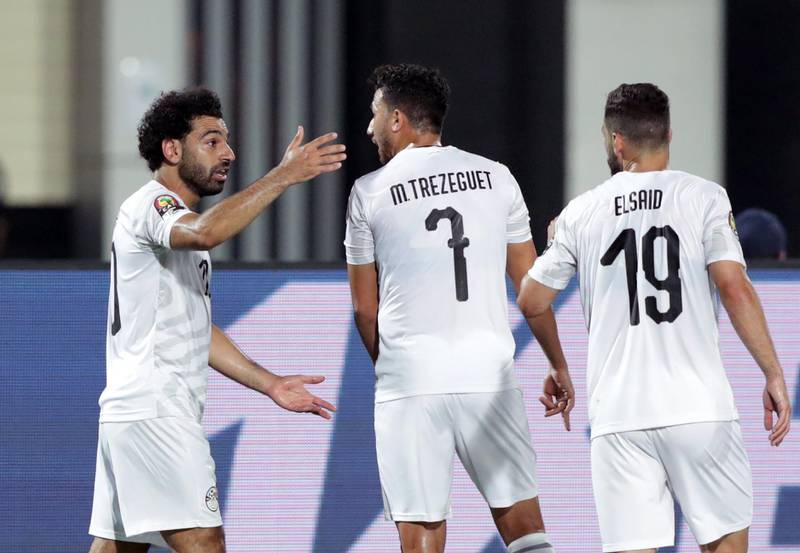 Egypt's Mohamed Salah celebrates with teammate Mahmoud 'Trezeguet' Hassan after scoring against Uganda. EPA