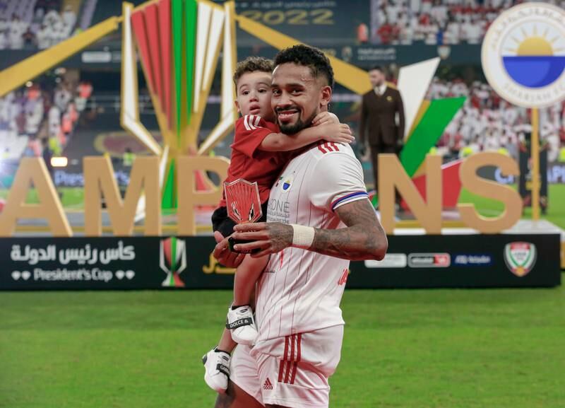 Caio Lucas with his son after Sharhah beat Al Wahda in the President's Cup final. Victor Besa / The National