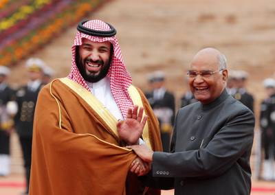 Prince Mohammed  shakes hands with India's President Ram Nath Kovind. Reuters