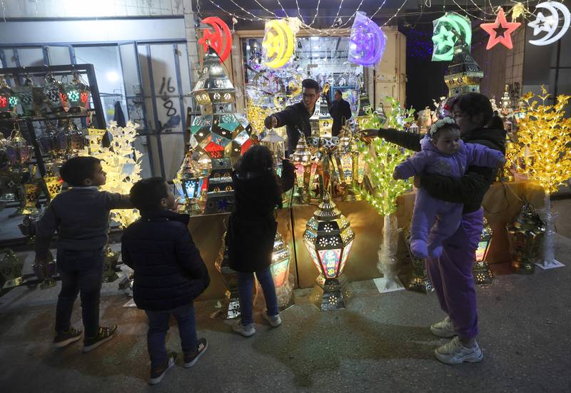 Palestinians shop for traditional 'fanous', a decoration used to celebrate the start of Ramadan, in Hebron in the occupied West Bank. AFP