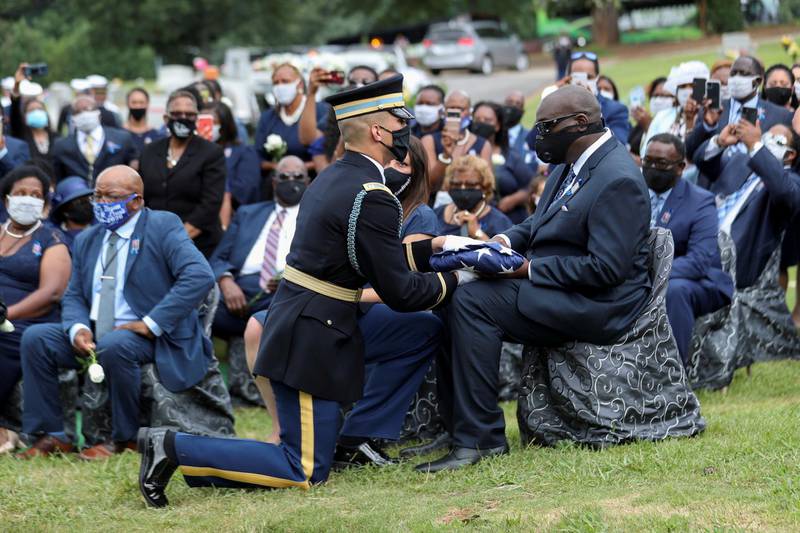 The Honour Guard presents the flag that was on the casket of late US Congressman John Lewis to his son, John-Miles Lewis, at the burial service in Atlanta, Georgia, USA. Reutres