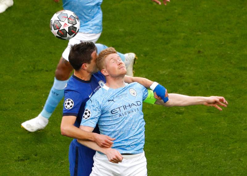 Chelsea's Cesar Azpilicueta and Kevin de Bruyne of City challenge for a header.
