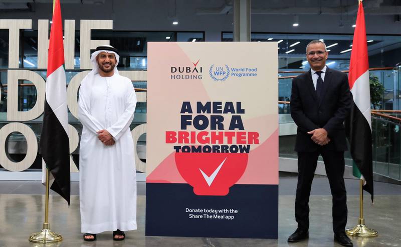 Dubai Holding managing director Khalid Al Malik (Dubai Holding Managing Director), left, with Mageed Yahia, director of World Food Programme UAE office and representative to the GCC, as they launch the A Meal for a Brighter Tomorrow campaign. Courtesy Dubai Holding