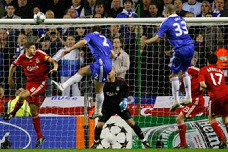 Chelsea's Branislav Ivanovic, centre, heads to score against Liverpool at Anfield.