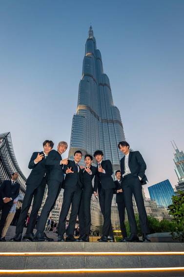 Members of Exo pose in front of the Burj Khalifa during their visit to Dubai last year. Courtesy Dubai Tourism