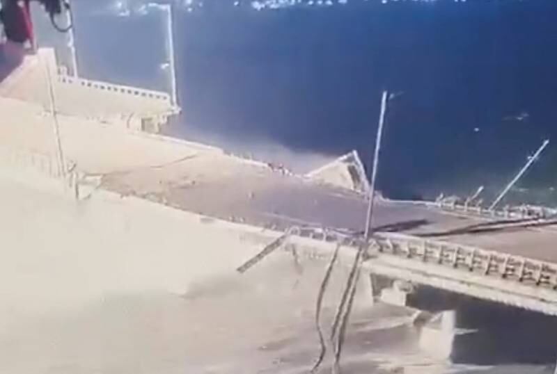 Part of the bridge collapses into the sea below. Reuters