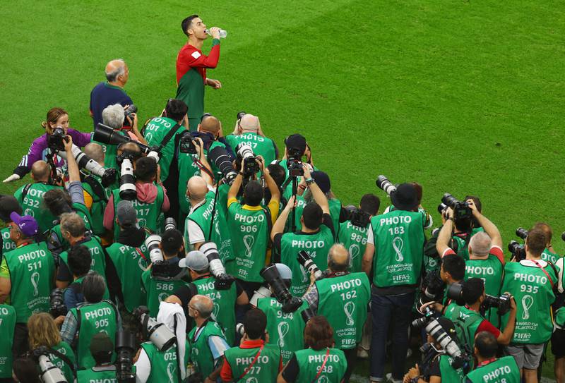Portugal's Cristiano Ronaldo is followed by a crowd of photographers before kick-off. Reuters