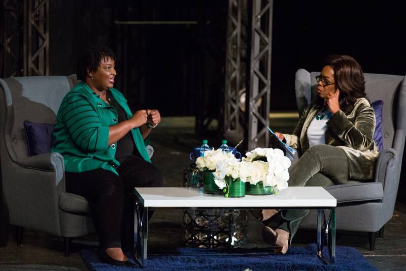 Oprah Winfrey interviews Ms Abrams in front of an audience at the Cobb Civic Centre in Marietta, Georgia. Getty