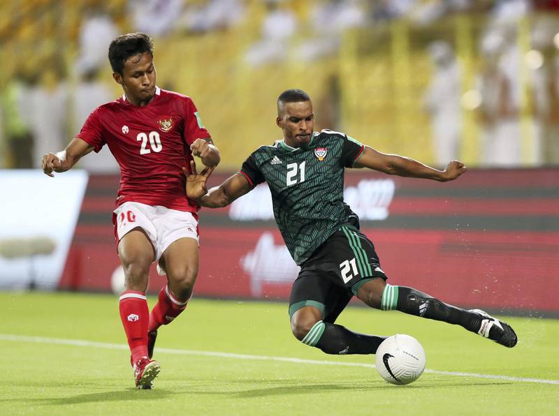Mahmoud Khamis of the UAE battles with Osvaldo Aediles Haay of Indonesia during the game between the UAE and Indonesia in the World cup qualifiers at the Zabeel Stadium, Dubai on June 11th, 2021. Chris Whiteoak / The National. 
Reporter: John McAuley for Sport