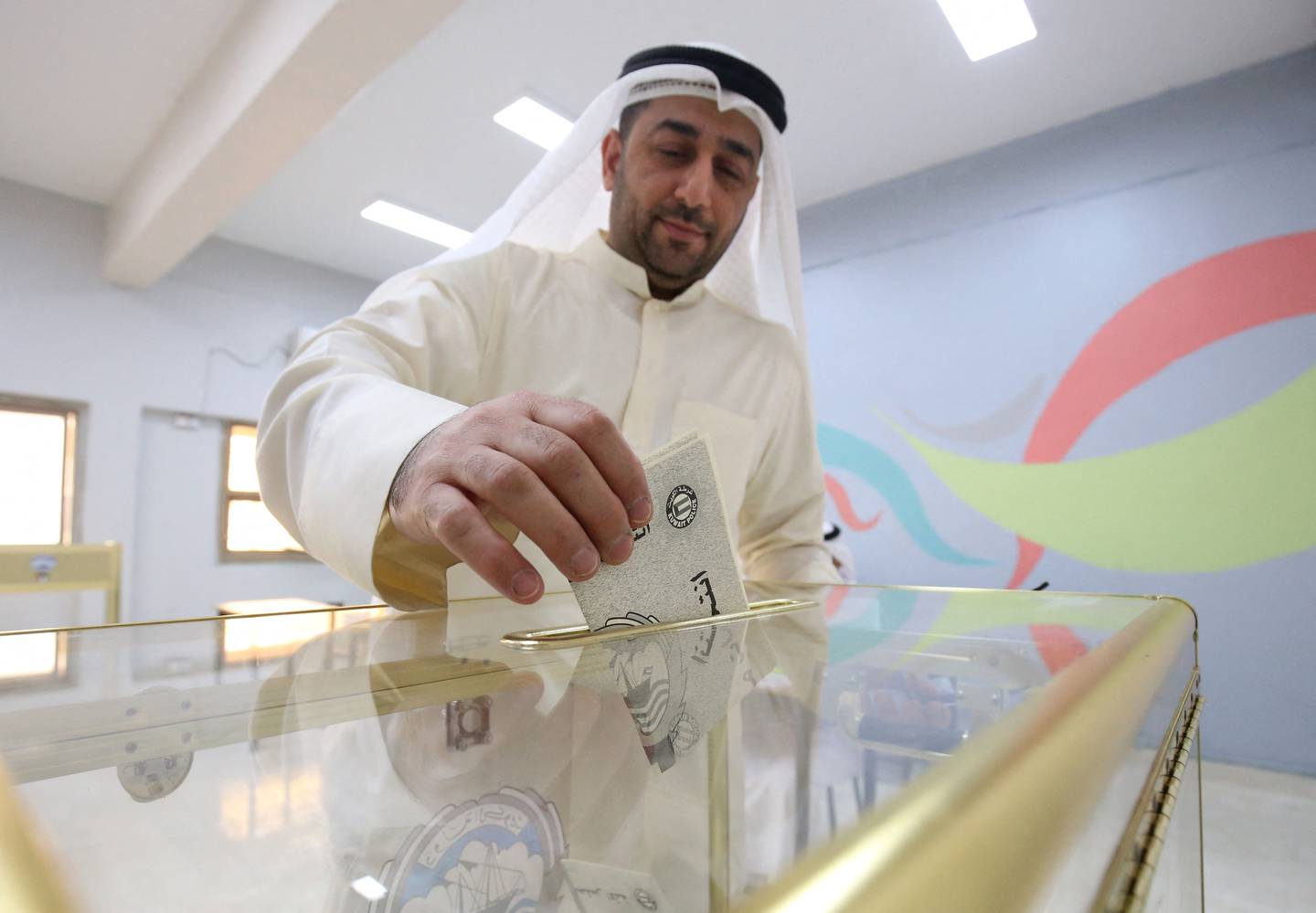 A Kuwaiti man casts his vote during parliamentary elections in Kuwait City on September 29, 2022. AFP