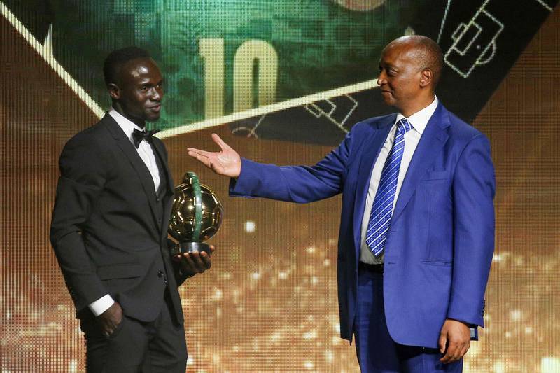 Senegalese forward Sadio Mane receives with the Men's Player of the Year from CAF President Patrice Motsepe during the 2022 Confederation of African Football (CAF) Awards on July 21, 2022, in the Moroccan capital Rabat.  AFP