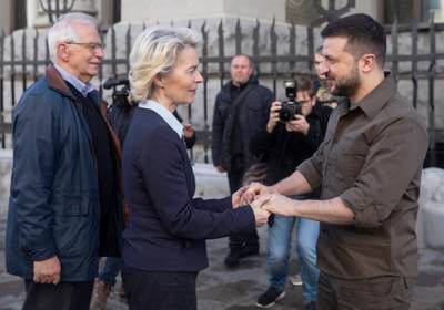 Ms von der Leyen shakes hands with President Zelenskyy as Mr Borrell looks on during their meeting in Kyiv. EPA