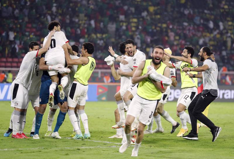 Egypt players celebrate winning the penalty shootout. Reuters