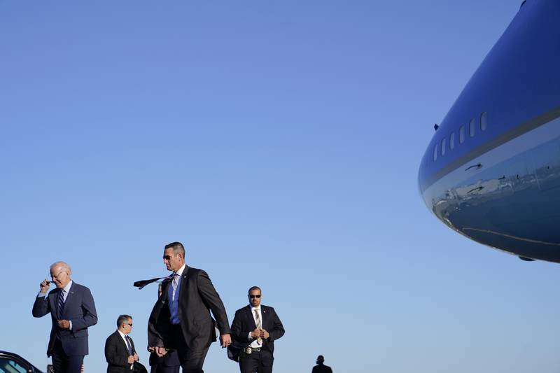 US President Joe Biden, left, and members of the Secret Service walk to his motorcade after stepping off Air Force One, in Philadelphia. Mr Biden is visiting Philadelphia to attend a reception for Pennsylvania Lt Governor John Fetterman, a Democratic party candidate for the US Senate. AP