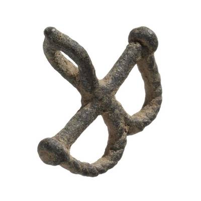 A miniature pair of bronze shackles used as a protective amulet by the Lobi tribe of West Africa. Courtesy Collection of the Smithsonian National Museum of African American History and Culture.