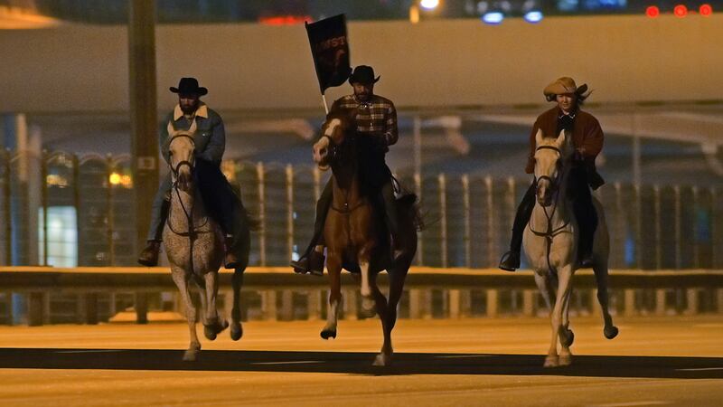 The group, or saunter, of cowboys set off on their ride down the Sheikh Zayed Road at 4am on Sunday morning. Photo: OSN
