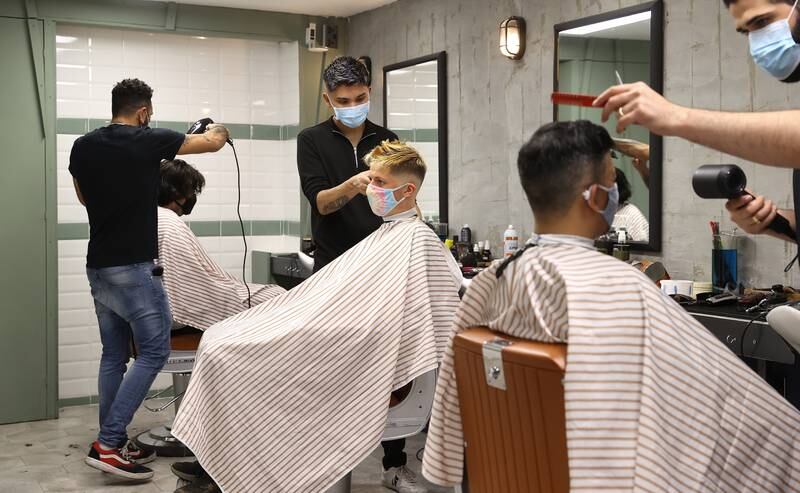 A barber shop re-opens on April 12, 2021 in London. Getty Images