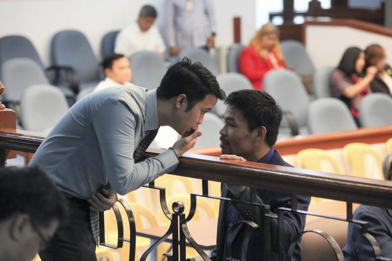 Eight-division boxing champion and Philippine Senator Manny Pacquiao attends a hearing in the Senate of the Philippines in Pasay City, Metro Manila.