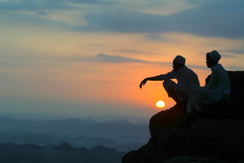 Two Saudi boys sit at the summit of Jabal Al Nour in 2004.