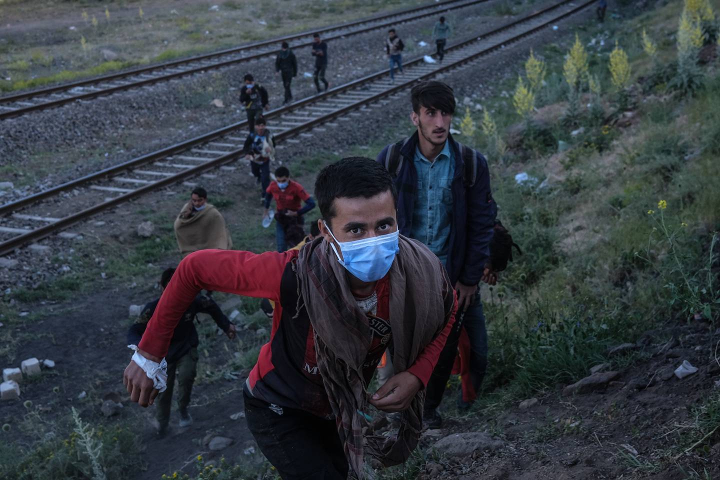 Afghans near Van city after crossing the Iran-Turkey border in Tatvan district, eastern Turkey. EPA 