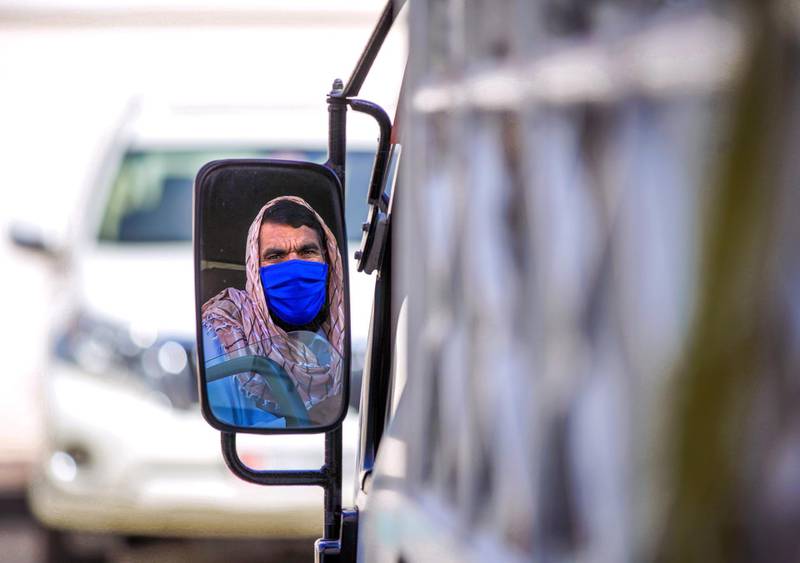 Abu Dhabi, United Arab Emirates, April 6, 2020.  A delivery driver wearing  a face mask at downtown Abu Dhabi.  UAE health ministry advised residents to wear a mask when they are outside, whether they are showing symptoms of Covid-19 or not.Victor Besa / The NationalSection:  NAReporter: