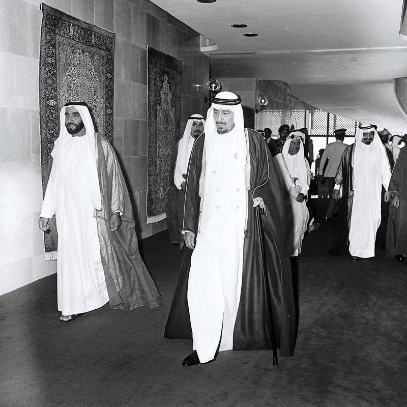 Sheikh Zayed, left, walks through the hallway of the InterContinental hotel in Abu Dhabi with Khalid bin Abdulaziz, the King of Saudi Arabia.