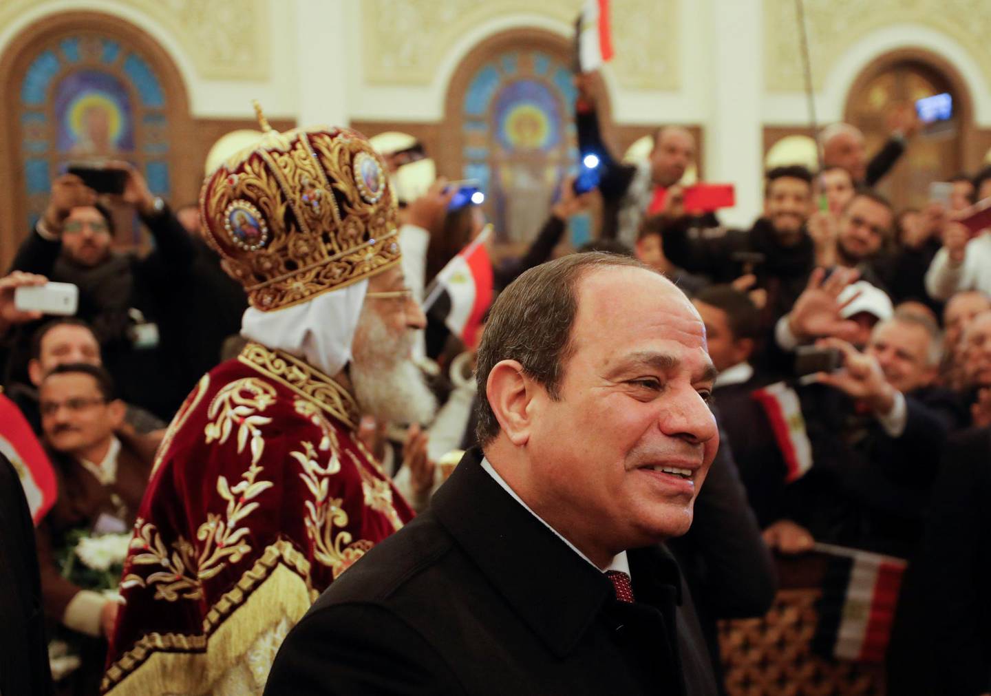 President Abdel Fattah al-Sisi looks on next to Pope Tawadros II, spiritual leader of the country's Coptic Orthodox Christians. Reuters. 