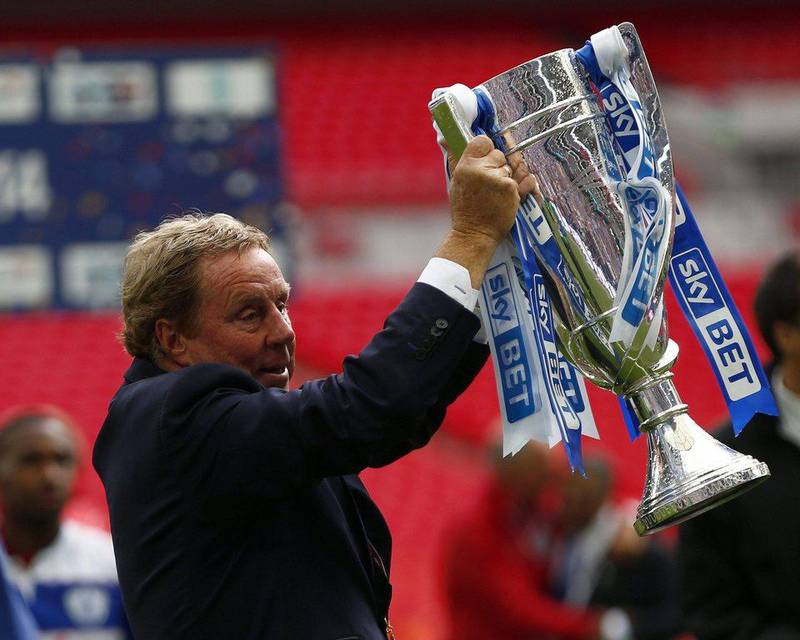 Harry Redknapp lifts the Championship play-off final trophy after QPR defeated Derby County in the match 1-0 on Saturday. Eddie Keogh / Reuters / May 24, 2014 