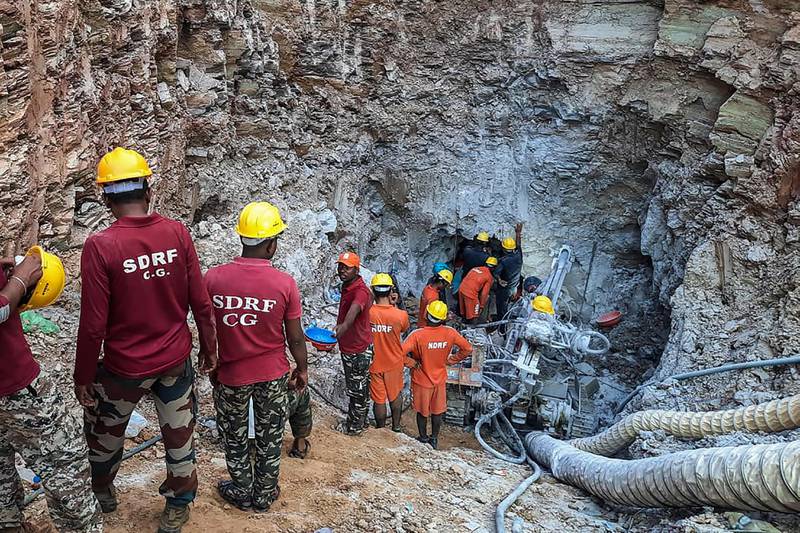 Rescue workers seen here trying to reach a 10-year-old boy trapped in a well in India’s Chattisgarh state on June 14. On Wednesday, rescuers were trying to save a toddler trapped in a sewer for more than 24 hours in northern Punjab state. AFP