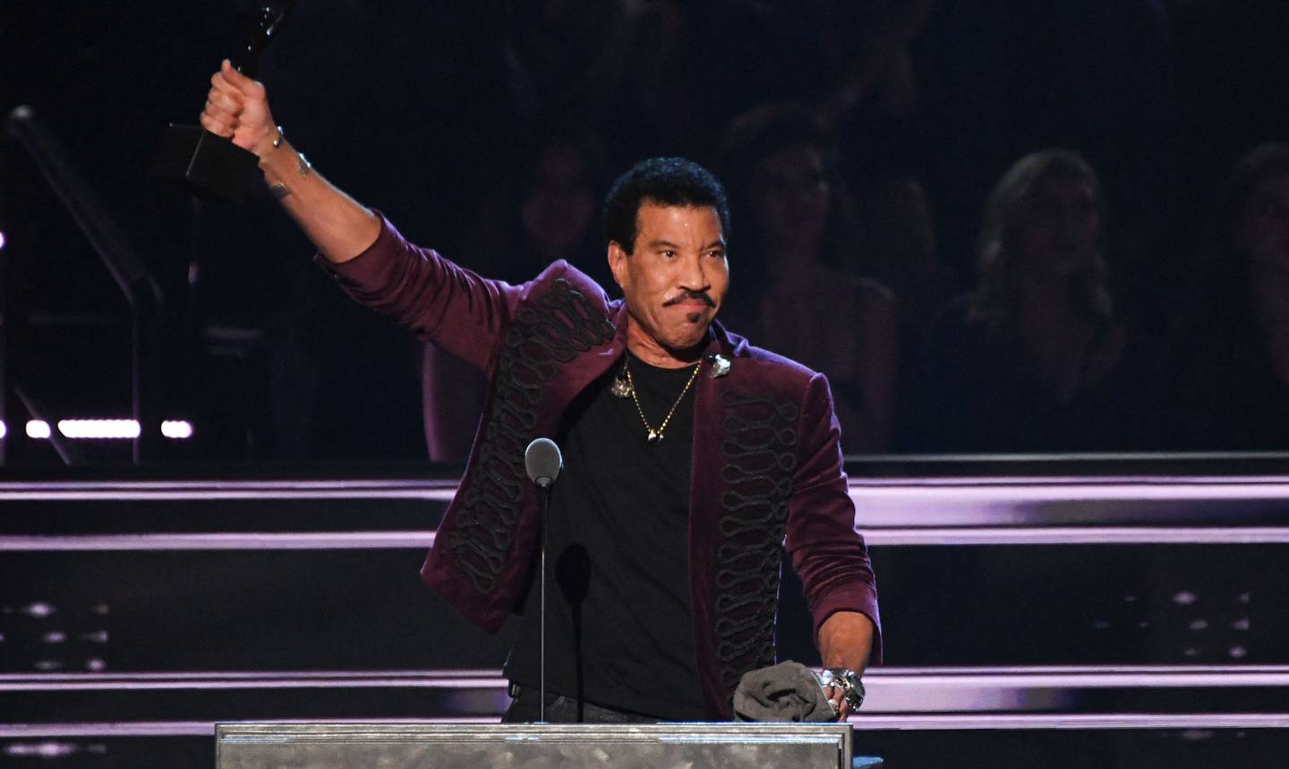 Singer-songwriter Lionel Richie speaks after his induction. AFP