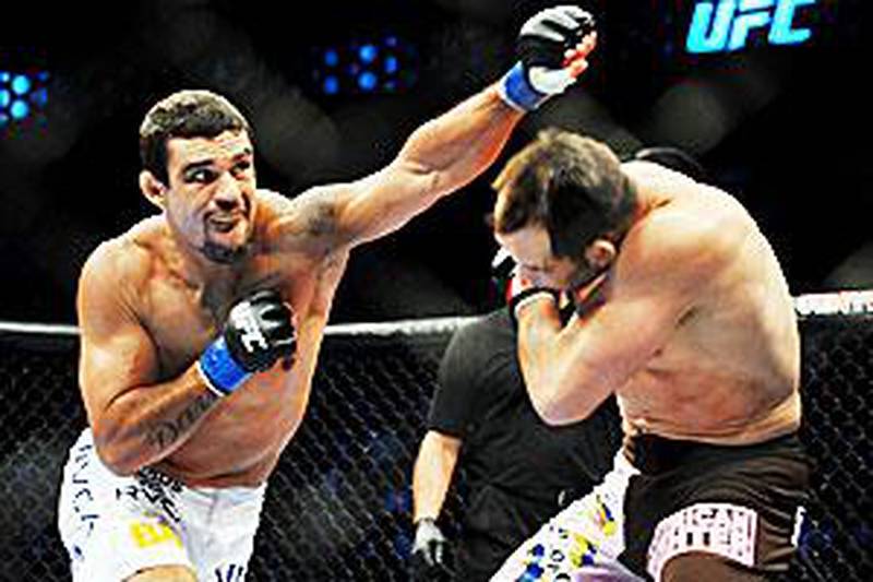 Vitor Belfort, left, is training hard and staying relaxed ahead of his fight with Anderson Silva.