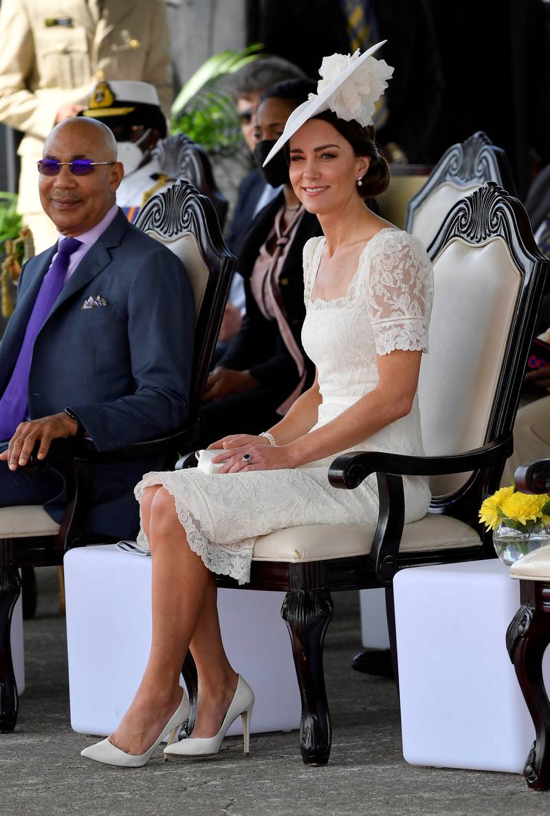 The Duchess of Cambridge, wearing white lace Alexander McQueen, attends the inaugural Commissioning Parade for service personnel completing the Caribbean Military Academy's Officer Training Programme in Kingston, Jamaica, on March 24. Reuters