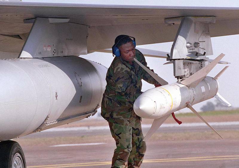 A US weapons technician secures an AGM-88 high-speed anti-radar missile at Incirlik Air Base in Turkey, after the jet returned from a mission over Iraq. AFP