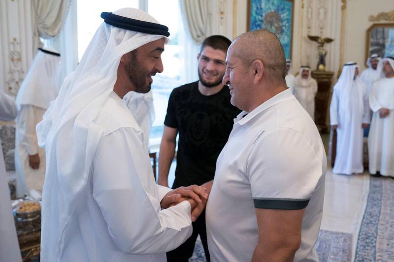ABU DHABI, UNITED ARAB EMIRATES - September 09, 2019: HH Sheikh Mohamed bin Zayed Al Nahyan, Crown Prince of Abu Dhabi and Deputy Supreme Commander of the UAE Armed Forces (L), receives the father of Khabib Nurmagomedov, UFC Lightweight Champion and winner of UFC 242 Abu Dhabi (back C), during a Sea Palace barza.

( Hamad Al Kaabi / Ministry of Presidential Affairs )​
---