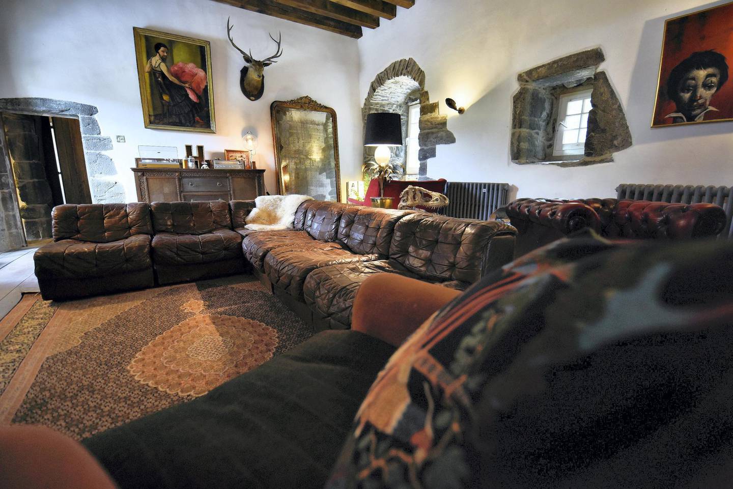 Traditional castle style, meets cosy contemporary living room, with plenty of vintage finds from the couple's travels. Courtesy Kilmartin Castle