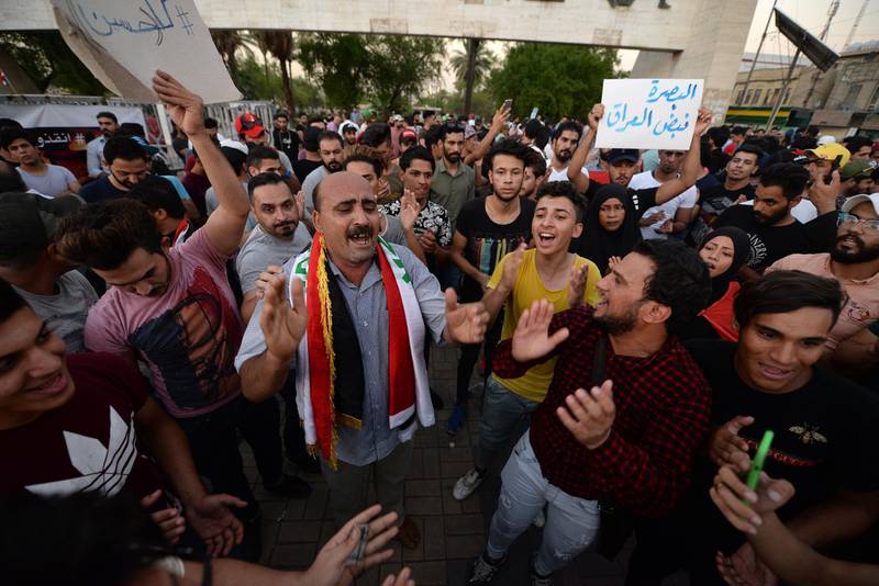 Iraqi protesters chant slogans during a demonstration to support the protesters in Basra city, at Tahrir Square in central Baghdad. EPA