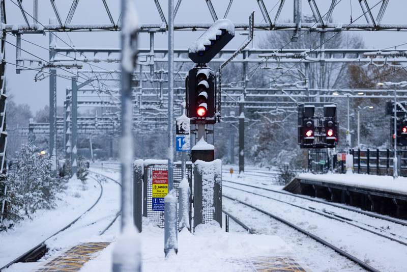 Snow-blanketed power cables and railway tracks in Shenfield, near London. Bloomberg