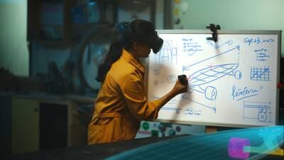 A woman uses Meta's Quest Pro device to write and draw on a whiteboard in mixed reality. Reuters